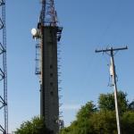 Concrete tower with steel superstructure