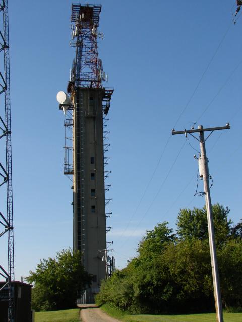 Concrete tower with steel superstructure