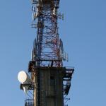 Steel A-tower atop concrete structure