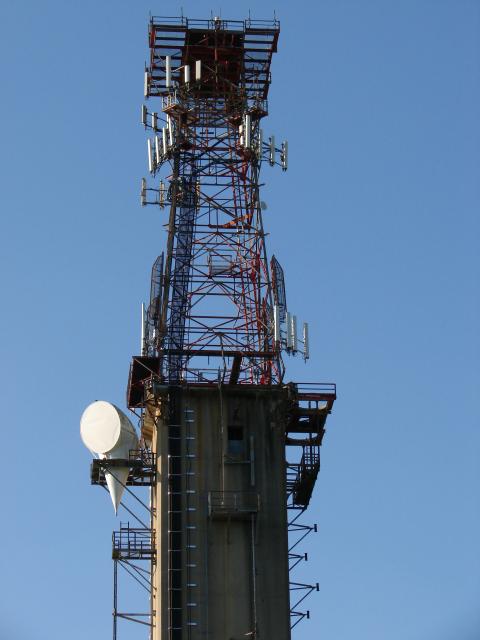 Steel A-tower atop concrete structure